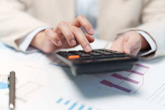Businesswoman Calculating Budget and Investment Finances