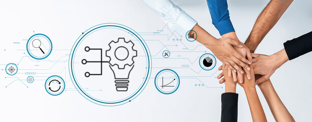 Obraz premium Hands from diverse individuals unite in a collaborative effort, showcasing teamwork and innovation against a digital graphic backdrop representing ideas and technology. Trope