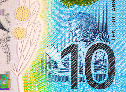 Australian 10 dollar polymer banknote showing the denomination number 10 and a line drawing fragment of Dame Mary Gilmore writing. Money of the world.