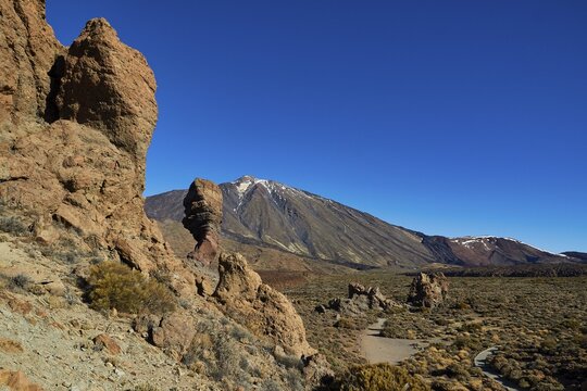 Rocky desert landscape with distinctive rocks and a mountain in the background under clear blue sky, UNESCO World Heritage Site, Teide National Park, Teide National Park, Tenerife, Canary Islands, Spain