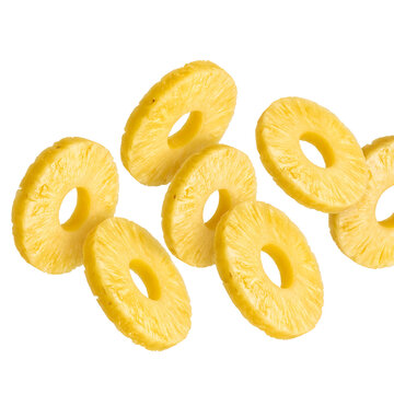 Sliced pineapple rings with vibrant yellow color and juicy texture for tropical fruit photography.