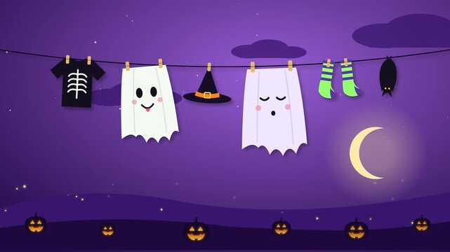 Looping Halloween animation of ghost sheets drying on a clothesline next to a skeleton shirt, a witch hat, green socks and a sleeping bat. Pumpkins glow on the ground and clouds.