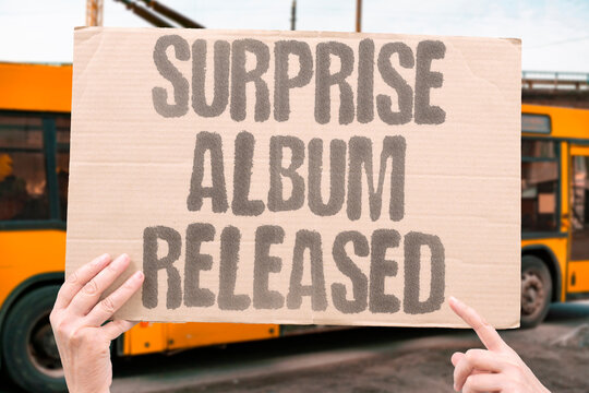 "Surprise album released" Singer unveils music without warning. SURPRISE. ALBUM. SINGER. MUSIC. FANS.