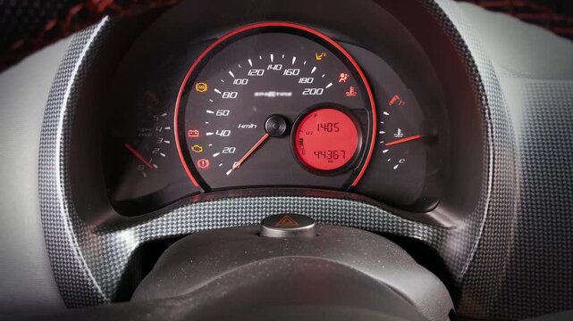 Close-Up View of Car Speedometer Dashboard Turning On Engine Start