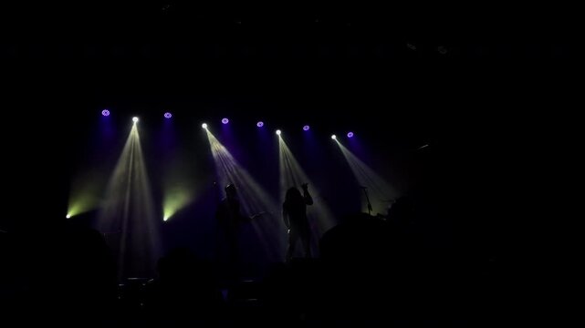 Slow Motion Concert Stage With Purple and White Light Beams