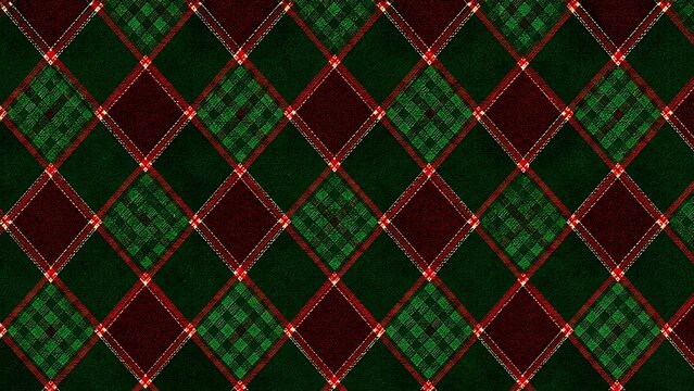 christmas Green and red diamond argyle pattern on a dark textured fabric background with repeating diamond