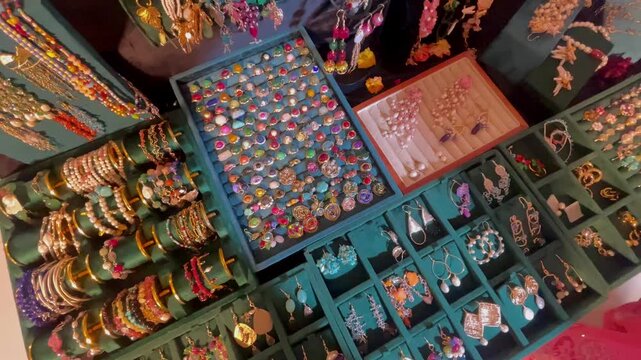 Display Trays of Colorful Fashion Jewelry Rings Earrings and Bangles