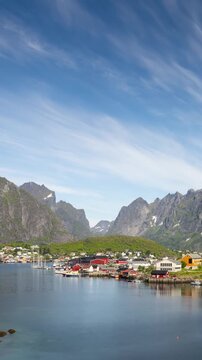 Time lapse of the clouds moving above he small town of Hamnoy in the Lofoten Islands in Northern Norway. Vertical video.