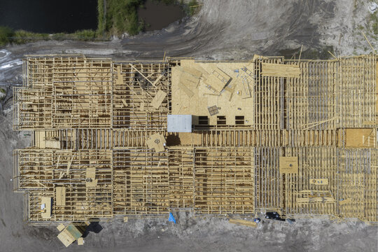 Aerial view of the wooden framing and plywood structure of the Hanover Gateway construction site in Pinellas Park, Florida, United States.