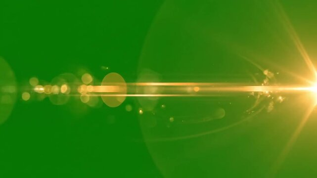 Bright Golden Light Flare and Bokeh Effect on Green Background