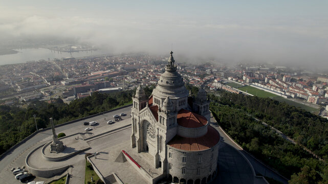 Aerial view of the Sanctuary of the Sacred Heart of Jesus with its dome and red-tiled roofs, overlooking the city in Viana do Castelo, Viana do Castelo Dist, Portugal.