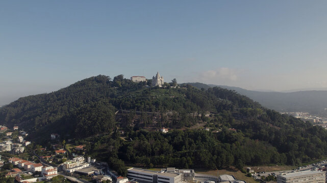 Aerial view of the Sanctuary of the Sacred Heart of Jesus situated on a lush forested hill overlooking the town of Viana do Castelo, Viana do Castelo Dist, Portugal.