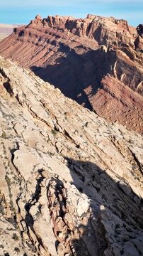 Aerial shot of the amazing landscapes and San Rafael Reef rock formations in Utah. Vertical video.