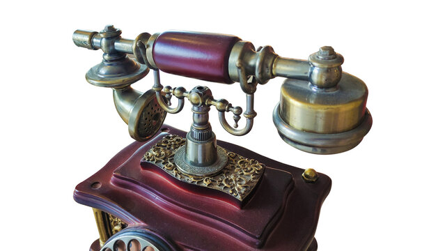 Vintage antique phone with wooden body and bronze or brass metal parts in a transparent background