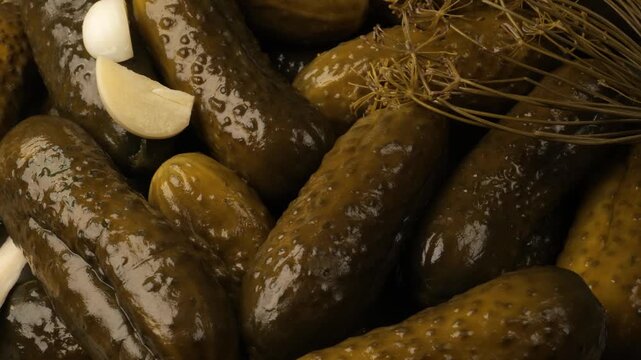 Pickled cucumbers with dill and garlic rotating