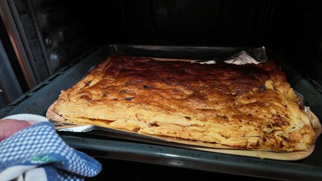 empanada coming out of the oven, Galician cuisine