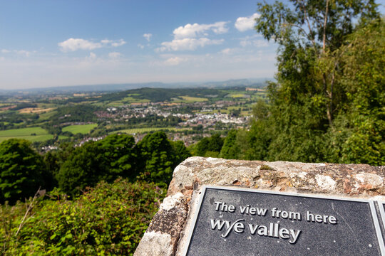 An information plaque reading The View From Here Wye Valley overlooking the scenic Monmouthshire countryside from The Kymin viewpoint in Wales