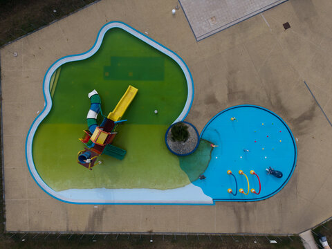 Aerial view of a colorful water park with slides and swimming pools in Chivasso, Piedmont, Italy.