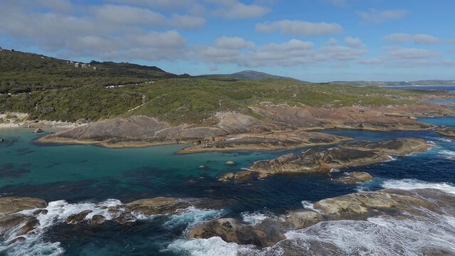 Aerial view of Greens Pool with turquoise water, granite boulders, coastal vegetation, and white sand in Denmark, Western Australia, Australia.