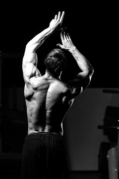 Middle Age Man Bodybuilder Flexing Back Pose