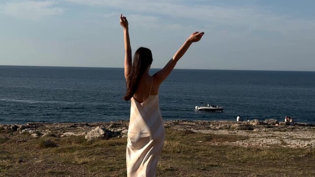 Woman Posing by the Rocky Adriatic Coast in Polignano a Mare, Italy