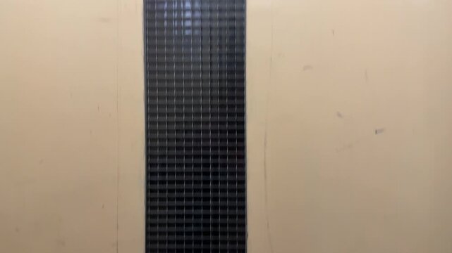 Old elevator moving up between floors, vintage lift interior detail, four floor