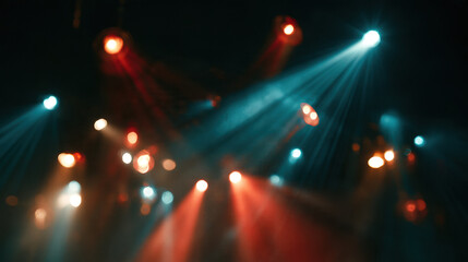 Fototapeta premium Stage spotlights colorful light beams concert bokeh dark background red teal nightclub party show entertainment event music