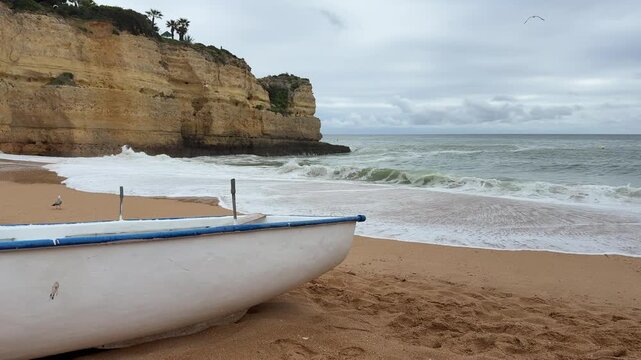 white boat on beach ocean waves cliff, copyspace banner, concept of travel tourism