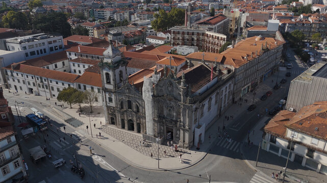 Aerial view of the historic Igreja dos Carmelitas with its ornate facade and surrounding terracotta rooftops in the urban landscape of Porto, Porto, Portugal.