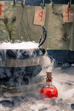 Blue potion flask sparkles in thick smoke.