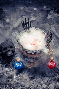 Mysterious alchemy scene with skull and potion.