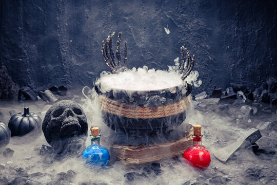 Dark skull rests beside a blue flask.