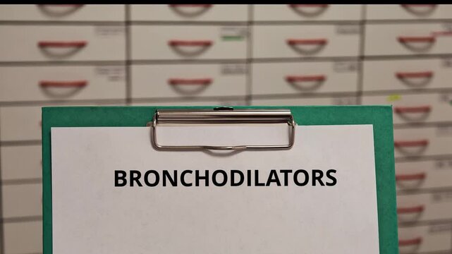 BRONCHODILATORS drug class and treatment concept displayed on a clipboard in a pharmacy