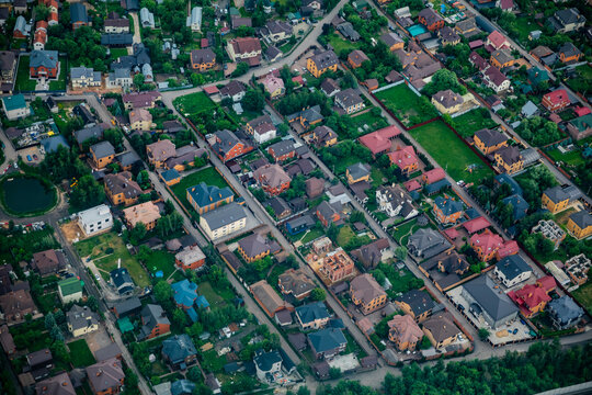 A top‑down view of a private residential area, the village of Dudkino, with cottages, gardens, and streets