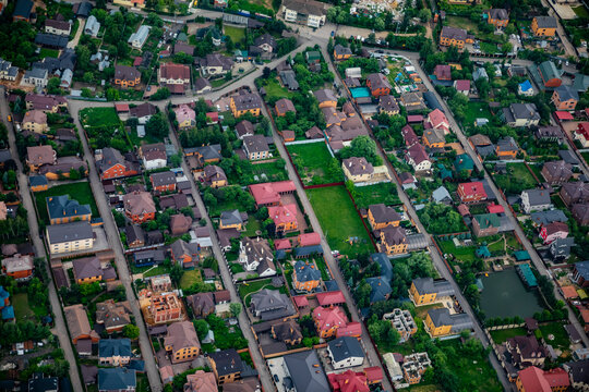 A top‑down view of a private residential area, the village of Dudkino, with cottages, gardens, and streets