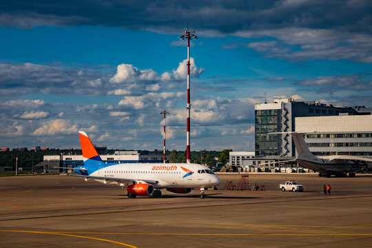 The white Sukhoi SuperJet 100‑95LR aircraft of Azimuth Airlines at Vnukovo Airport