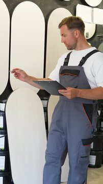 Warehouse worker checking inventory with a clipboard