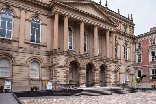 Historic Osgoode Hall courthouse facade featuring grand columns and arched windows with construction fencing at the entrance, September 2026