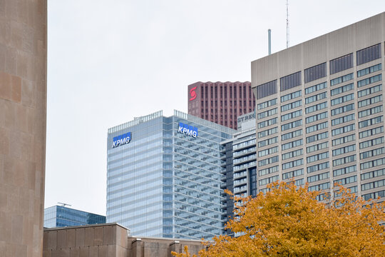 Low angle view of the modern glass KPMG office building in Toronto's financial district, representing corporate business and professional services, September 2026
