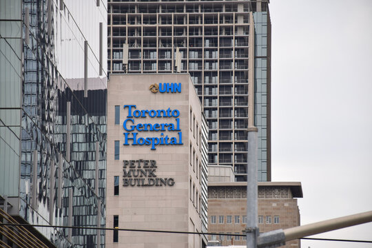 Exterior view of the Toronto General Hospital Peter Munk Building featuring prominent blue UHN and hospital signage on the facade, September 2026