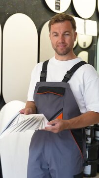 Professional painter choosing paint color from swatch book