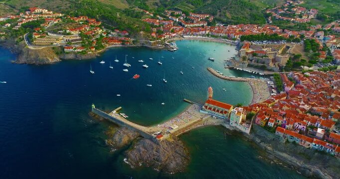 Aerial view of the beautiful, picturesque village of Collioure on the Mediterranean coast, featuring the lovely Fort Saint Elme by the sea, France, near the city of Perpignan.