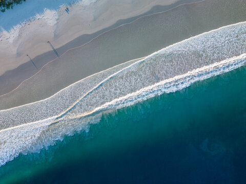 Aerial view of Middleton Beach with turquoise waves crashing onto the white sand shore, captured from a high angle in Albany, WA, Australia.