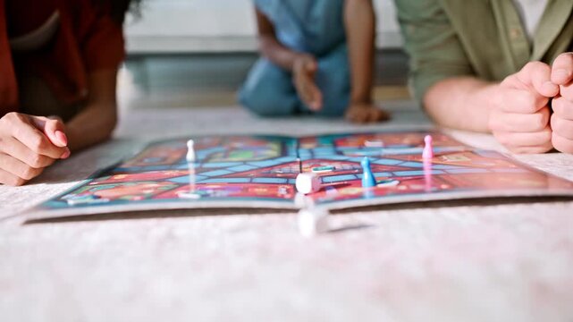 Interracial family playing board game home floor. Girl moving pawn laughing.