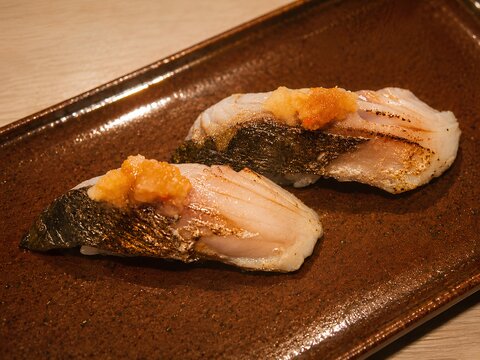 Seared Fish Nigiri Sushi with Seaweed and Japanese Garnish