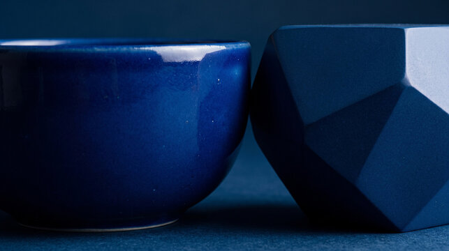 Close-up cobalt ceramic with geometric facets for a luxury abstract backdrop
