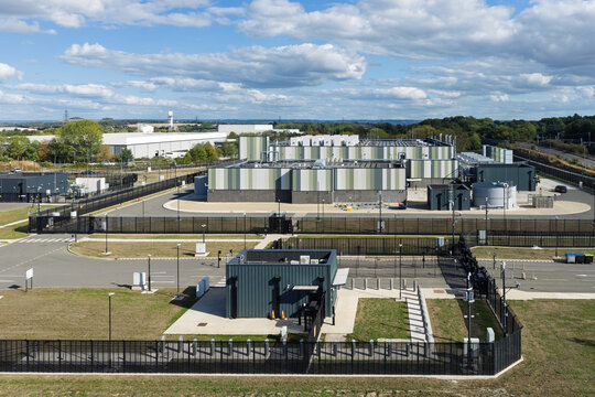 Aerial view of a modern data center facility with security fencing and access control in the United Kingdom.