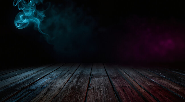 Background of empty dark scene with wooden old floor. Neon light smoke. Dark abstract background. Night wooden table
