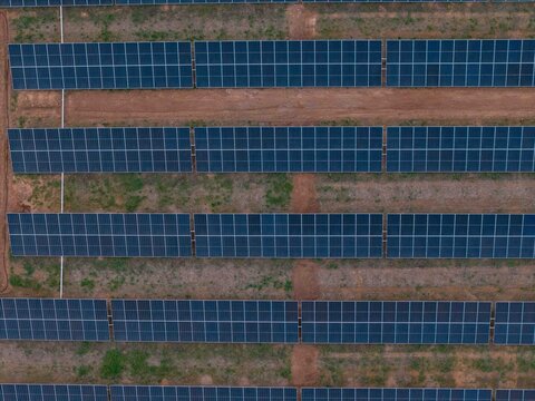 Aerial view of solar panels arranged in rows at a solar farm in Bonnievale, Western Cape, South Africa.