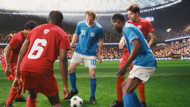 Soccer player controls the ball during an attacking run, accelerating past defenders with speed and agility while showing football footwork and possession on a stadium pitch during competitive play.